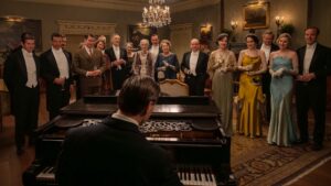 Allen Leech as Tom Branson, Dominic West as Guy Dexter, Robert James-Collier as Thomas Barrow, Douglas Reith as Lord Merton, Sarah Crowden as Lady Manville, Penelope Wilton as Isobel Merton, Paul Giamatti as Harold Levinson, Elizabeth McGovern as Cora Grantham, Michelle Dockery as Lady Mary, Hugh Bonneville as Robert Grantham, Laura Carmichael as Lady Edith and Harry Hadden-Paton as Bertie Hexham in Downton Abbey: The Grand Finale, directed by Simon Curtis. Photo: Rory Mulvey. Copyright: Focus Features LLC. All Rights Reserved.