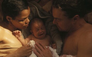 Teyana Taylor as Perfidia And Leonardo DiCaprio as Bob Ferguson in One Battle After Another, directed by Paul Thomas Anderson. Copyright: Warner Bros. Pictures. All Rights Reserved.