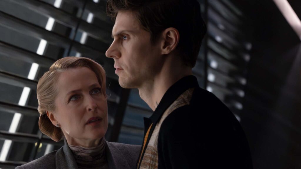 Gillian Anderson as Elisabeth Dillinger and Evan Peters as Julian Dillinger in Tron: Ares, directed by Joachim Ronning. Photo: Leah Gallo. Copyright: Disney Enterprises, Inc. All Rights Reserved.